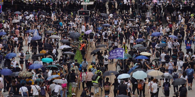 Pro-democracy protesters march during a protest against Beijing's national security legislation in Hong Kong, Sunday, May 24, 2020. (AP Photo/Vincent Yu)