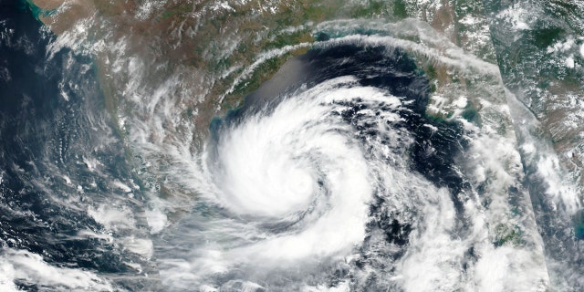 This May 17 satellite image released by NASA shows Cyclone Amphan over the Bay of Bengal in India.