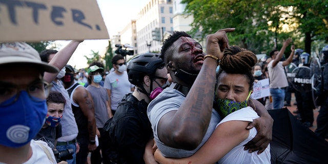 A demonstrator is injured as people protest the death of George Floyd, Saturday, May 30, 2020, near the White House in Washington. Floyd died after being restrained by Minneapolis police officers. (Associated Press)