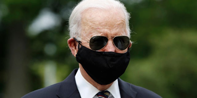 Democratic presidential candidate, former Vice President Joe Biden, with Jill Biden, departs after laying a wreath at the Delaware Memorial Bridge Veterans Memorial Park, Monday, May 25, 2020, in New Castle, Del. (AP Photo/Patrick Semansky)