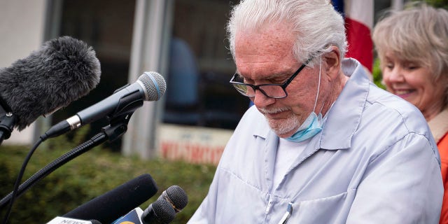 Manke became emotional while speaking during a press conference Monday at outside his barbershop in Owosso after a judge declined to sign a suspension order before holding a hearing. (Sarahbeth Maney/The Flint Journal via AP)