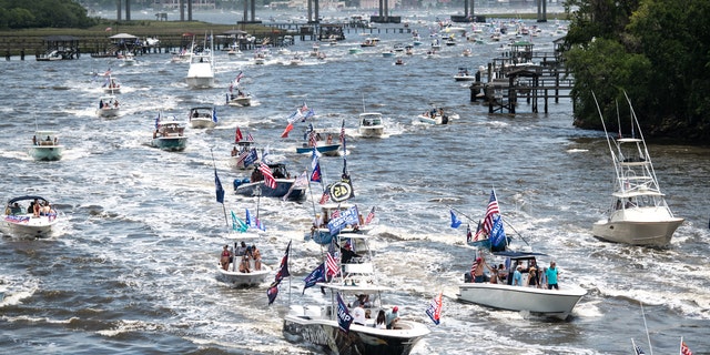 Boaters participate in the Make America Great Again parade May 24, 2020, in Charleston, South Carolina. A Facebook post noted the event, which was scheduled to begin at the U.S. Coast Guard station on the battery in Downtown Charleston and wind it's way up the harbor, was hosted by OSR Marine, a marine supply store. (Photo by Sean Rayford/Getty Images)