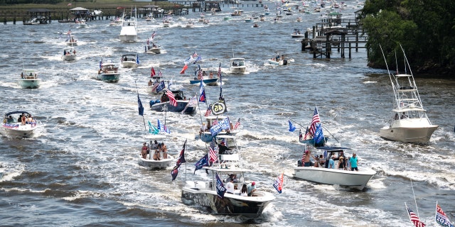 Boaters participate in the Make America Great Again parade May 24, 2020, in Charleston, South Carolina. A Facebook post noted the event, which was scheduled to begin at the U.S. Coast Guard station on the battery in Downtown Charleston and wind it's way up the harbor, was hosted by OSR Marine, a marine supply store. (Photo by Sean Rayford/Getty Images)