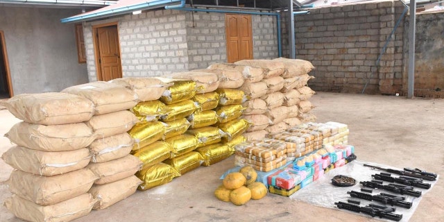 Weapons, ammunition, alongside bags of crystal methamphetamine and meth-laced yaba pills seized by Myanmar police and military are seen in this undated photo near Loikan village in Shan State, between February and April 2020 in what the United Nations Office on Drugs and Crime described as Asia's biggest-ever drug bust.