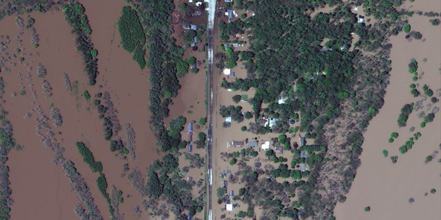 Flood residential neighborhoods can be seen in satellite images in central Michigan on Wednesday.