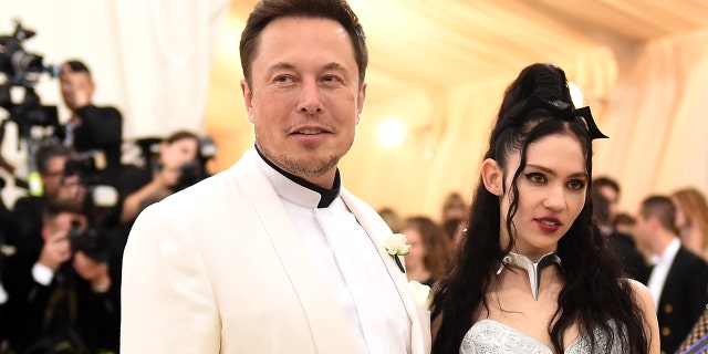 NEW YORK, NY - MAY 07: Elon Musk and Grimes attend the Heavenly Bodies: Fashion & The Catholic Imagination Costume Institute Gala at The Metropolitan Museum of Art on May 7, 2018, in New York City. (Photo by Jason Kempin/Getty Images)