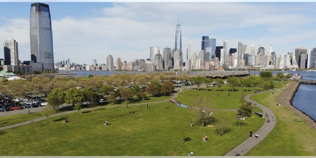People enjoy the good weather while keeping their distance from one another at Liberty State Park in Jersey City, N.J., on May 2. (AP)