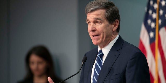 North Carolina Governor Roy Cooper updates the public during a press briefing on the coronavirus pandemic at the Emergency Operations Center, Thursday, May 14, 2020, in Raleigh, N.C. (Robert Willett/The News &amp;amp; Observer via AP)