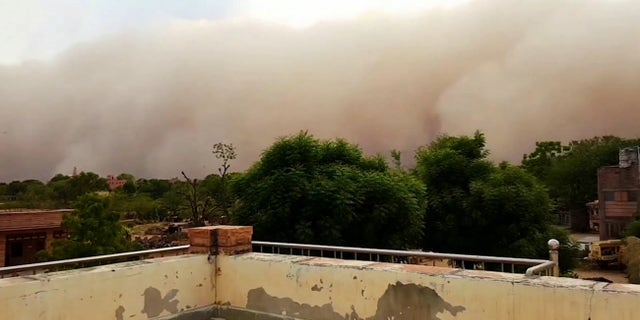 A video grab from the frightening moment a giant sandstorm looms and slowly engulfs the city of Rajasthan, northern India. May 17 2020.
