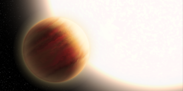 This is an artist's illustration of the super-hot exoplanet WASP-79b, located 780 light-years away. The planet orbits precariously close to a star that is much hotter than our Sun. The planet is larger than Jupiter, and its very deep, hazy atmosphere sizzles at 3,000 degrees Fahrenheit — the temperature of molten glass. The Hubble Space Telescope and other observatories measured how starlight is filtered through the planet's atmosphere, allowing for its chemical composition to be analyzed. Hubble has detected the presence of water vapor. (Credits: NASA, ESA and L. Hustak (STScI))