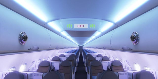 In an image, Airbus shows sensing devices affixed to overhead bins inside an airplane. (Credit: Airbus)