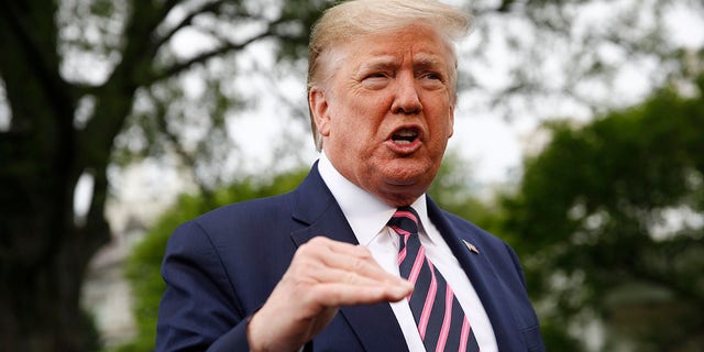 President Trump spoke to members of the media on the South Lawn of the White House in Washington on Tuesday before boarding Marine One for a short trip to Andrews Air Force Base, Md., and then on to Phoenix, Ariz. (AP Photo/Patrick Semansky)