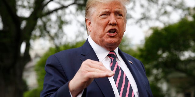 President Trump spoke to members of the media on the South Lawn of the White House in Washington on Tuesday before boarding Marine One for a short trip to Andrews Air Force Base, Md., and then on to Phoenix, Ariz. (AP Photo/Patrick Semansky)