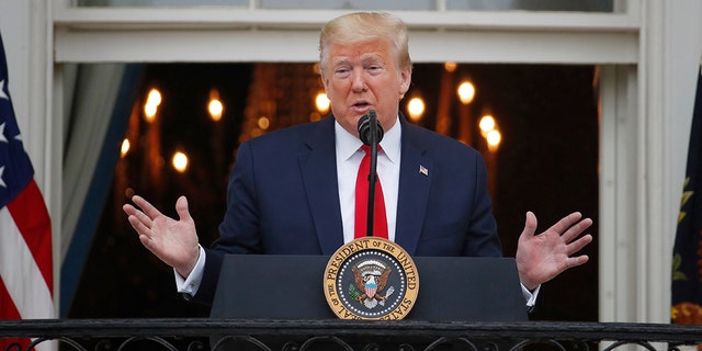 President Donald Trump speaks during a "Rolling to Remember Ceremony," to honor the nation's veterans and POW/MIA, from the Blue Room Balcony of the White House, Friday, May 22, 2020, in Washington. (AP Photo/Alex Brandon)