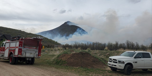 The Saddle Fire burned around 200 acres after starting on Tuesday. Officials said the blaze was human-caused, and that a juvenile has been taken into custody in connection with the blaze and other recent fires.
