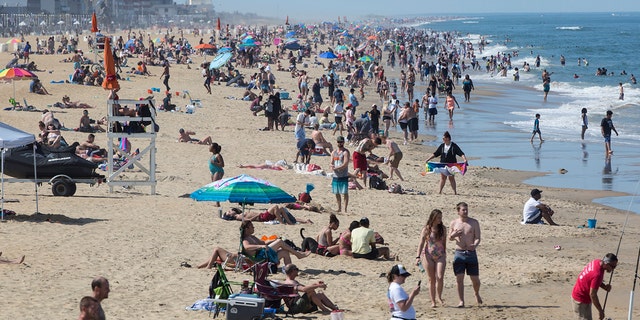 Warm weather draws crowds to the oceanfront, May 16 in Virginia Beach, Va. (Kaitlin McKeown/The Daily Press via AP)