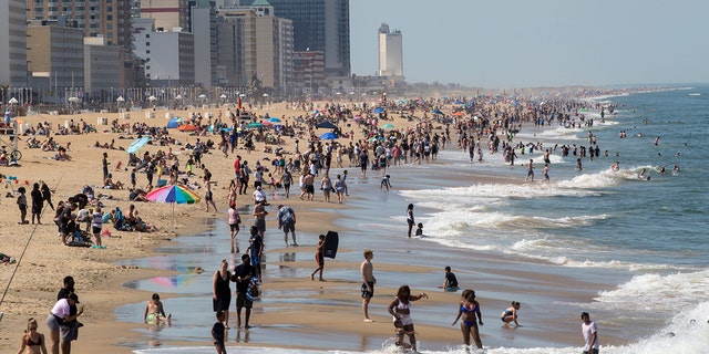 Warm weather draws crowds to the oceanfront May 16 in Virginia Beach, Va. (Kaitlin McKeown/The Daily Press via AP)