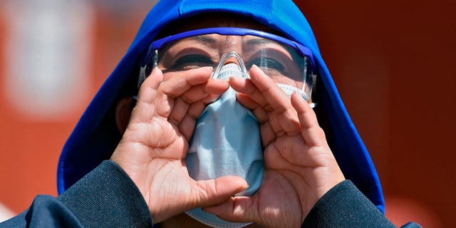 Loud talking can leave coronavirus in air for up to 14 minutes, study says | Fox News