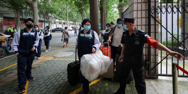Senior students returned to classes on Wednesday in the central Chinese city of Wuhan, the epicenter of the coronavirus pandemic, after no new cases or deaths were reported from the outbreak that had prompted a 76-day quarantine in the city of 11 million. (Chinatopix via AP)