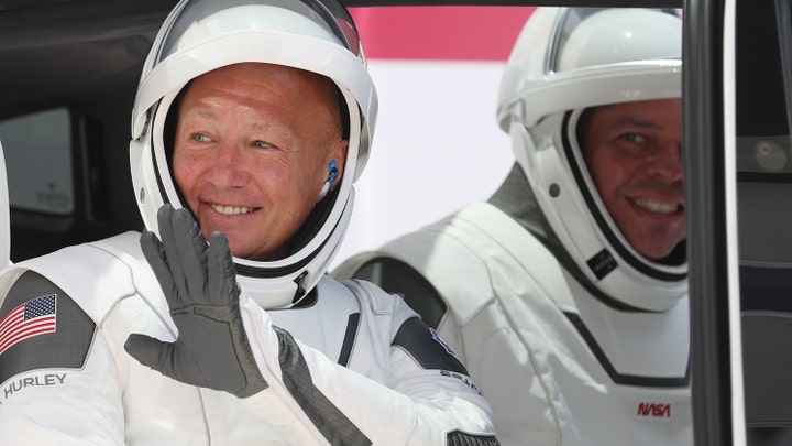 NASA astronauts Behnken and Hurley launch into orbit