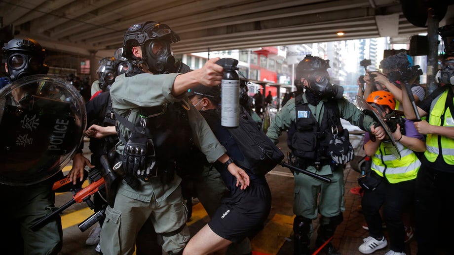 Hong Kong police fire tear gas, water cannon as pro-democracy supporters protest new China law