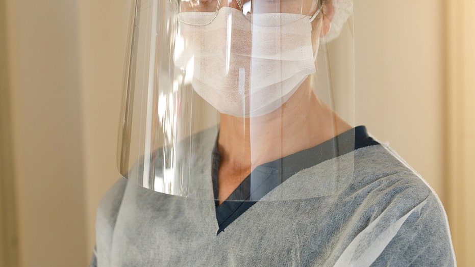 https://a57.foxnews.com/static.foxnews.com/foxnews.com/content/uploads/2020/05/931/524/woman-face-shield-face-mask-istock.jpg