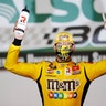 Kyle Busch celebrates after winning the NASCAR Xfinity Series auto race at the Charlotte Motor Speedway in Concord, N.C., May 25, 2020.