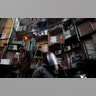 A woman walks wearing a face shield at the Villa 31 neighborhood during a government-ordered lockdown to curb the spread of the coronavirus in Buenos Aires, Argentina, May 4, 2020. 