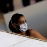 A woman wears a face mask at the bus station in Brasília, Brazil, May 11, 2020. 