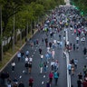 People exercise along Paseo de la Castellana in Madrid, Spain, May 9, 2020. 