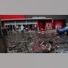 Debris and carts are strewn in the Target parking lot near the Minneapolis Police Third Precinct, Thursday, May 28, 2020, following a night of rioting and looting as protests continue over the arrest of George Floyd who died in police custody. Floyd died after being restrained by Minneapolis police officers on Memorial Day. A video taken by a bystander shows a Minneapolis police officer with his knee on the neck of a man in custody who later died. The four officers involved have been fired