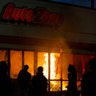 A fire burns in an AutoZone store during a protest Wednesday, May 27, 2020, in Minneapolis against the death of George Floyd in Minneapolis police custody earlier in the week.