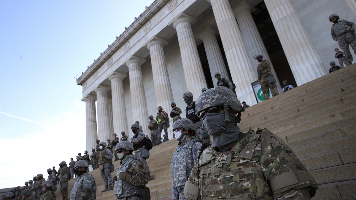 Members of the D.C. National Guard stand on the steps of the Lincoln Memorial as demonstrators participate in a peaceful protest against police brutality and the death of George Floyd, on June 2, 2020 in Washington, DC. Protests continue to be held in cities throughout the country over the death of George Floyd, a black man who was killed in police custody in Minneapolis on May 25.