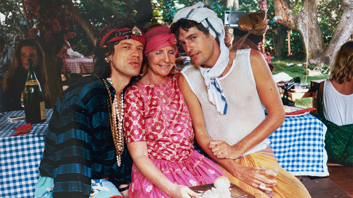 Lady Anne Glenconner (center) with Mick Jagger (left) and Rupert Everett.