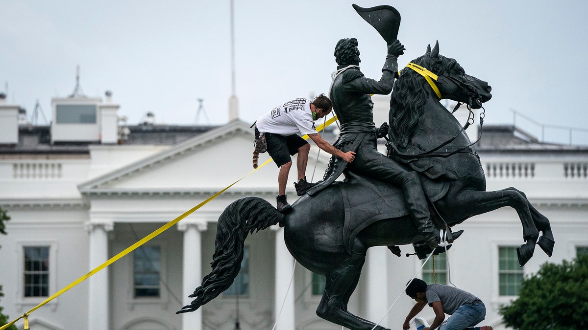 WASHINGTON, DC - JUNE 22: Protesters attempt to pull down the statue of Andrew Jackson in Lafayette Square near the White House on June 22, 2020 in Washington, DC. Protests continue around the country over police brutality, racial injustice and the deaths of African Americans while in police custody. (Photo by Drew Angerer/Getty Images)