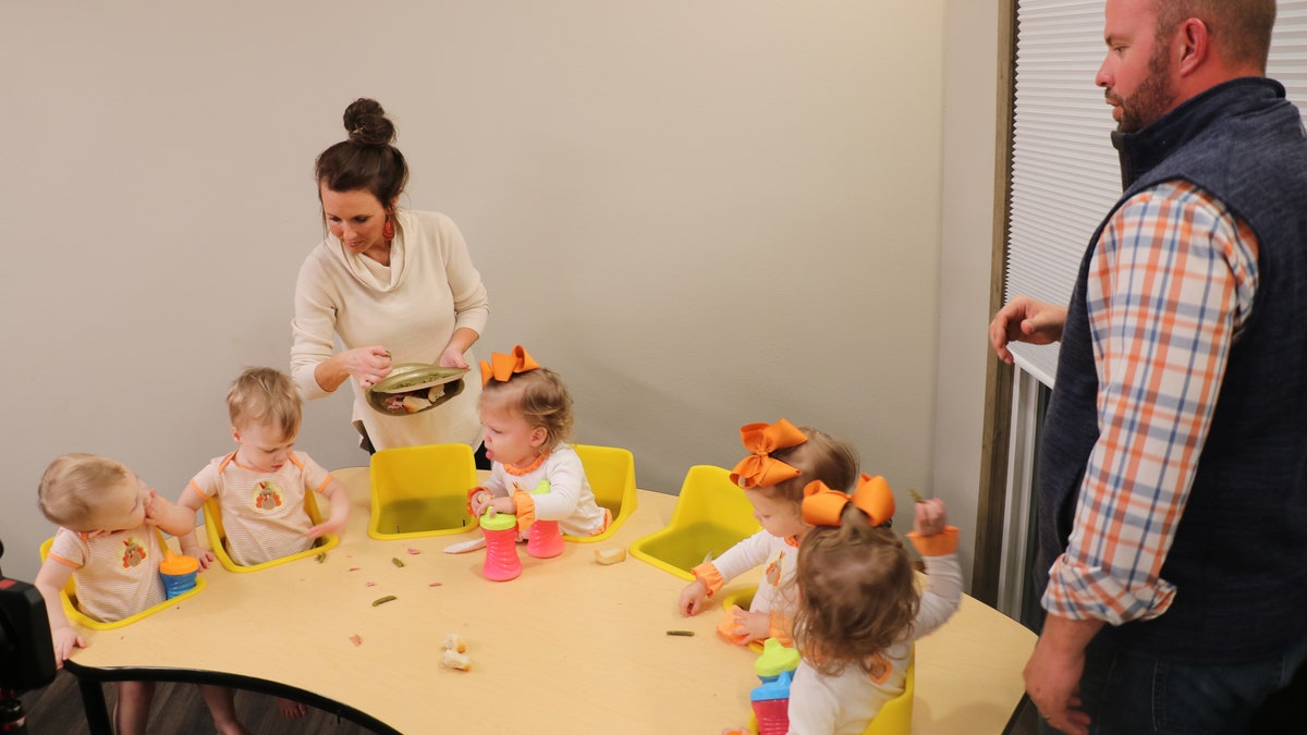 Eric (L) and Courtney (R) feeding the six babies.