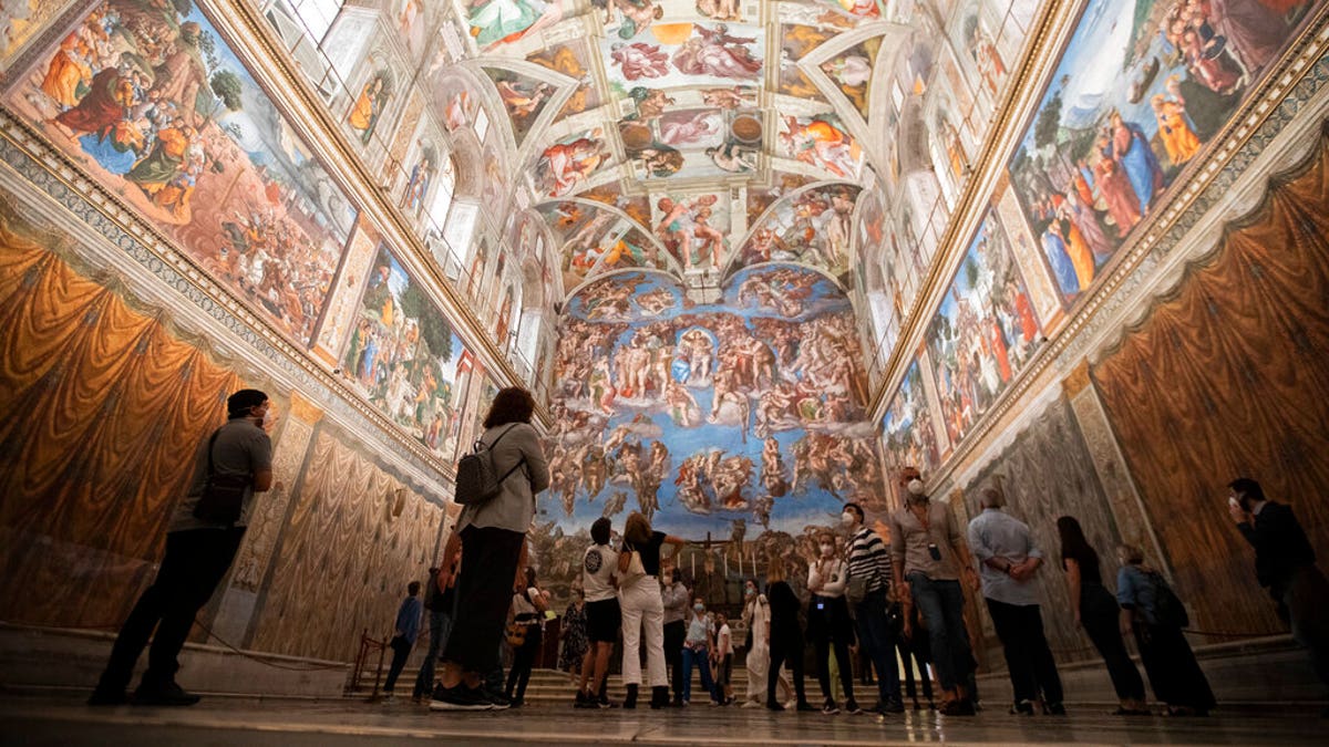 Visitors admire the Sistine Chapel as the Vatican Museum reopened, in Rome, Monday, June 1, 2020 after museums reopened. 