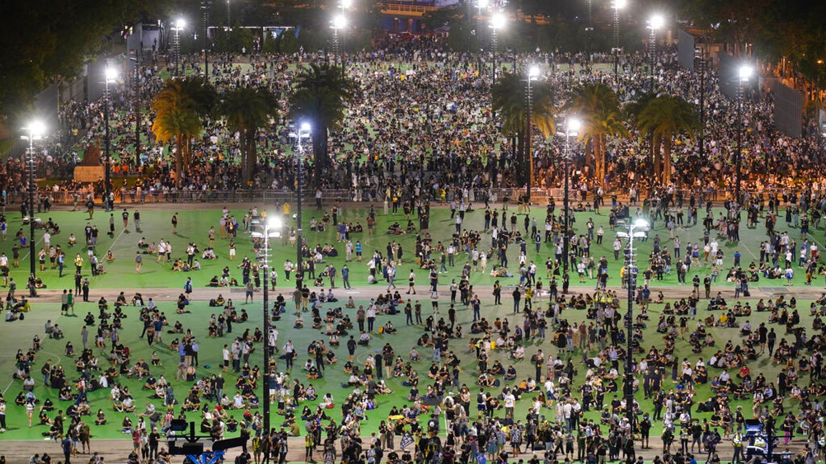 In this aerial view, participants gather for a vigil to remember the victims of the 1989 Tiananmen Square Massacre, despite permission for it being officially denied, at Victoria Park in Causeway Bay, Hong Kong, Thursday, June 4, 2020. (AP Photo/Vincent Yu)