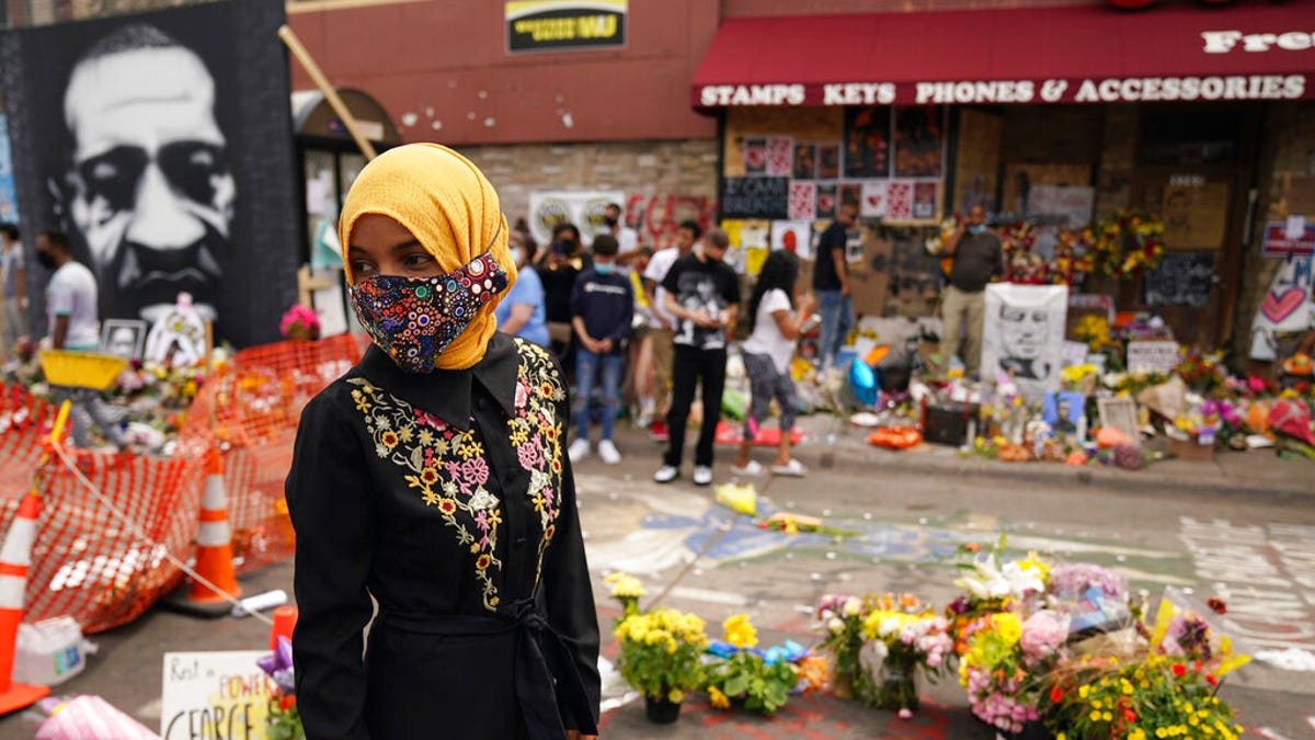 U.S. Rep. Ilhan Omar, along with members of the United States Congressional Black Caucus, visit the site where George Floyd died Thursday, June 4, 2020 in Minneapolis. Floyd who died after being restrained by Minneapolis police officers on May 25. (Anthony Souffle/Star Tribune via AP)