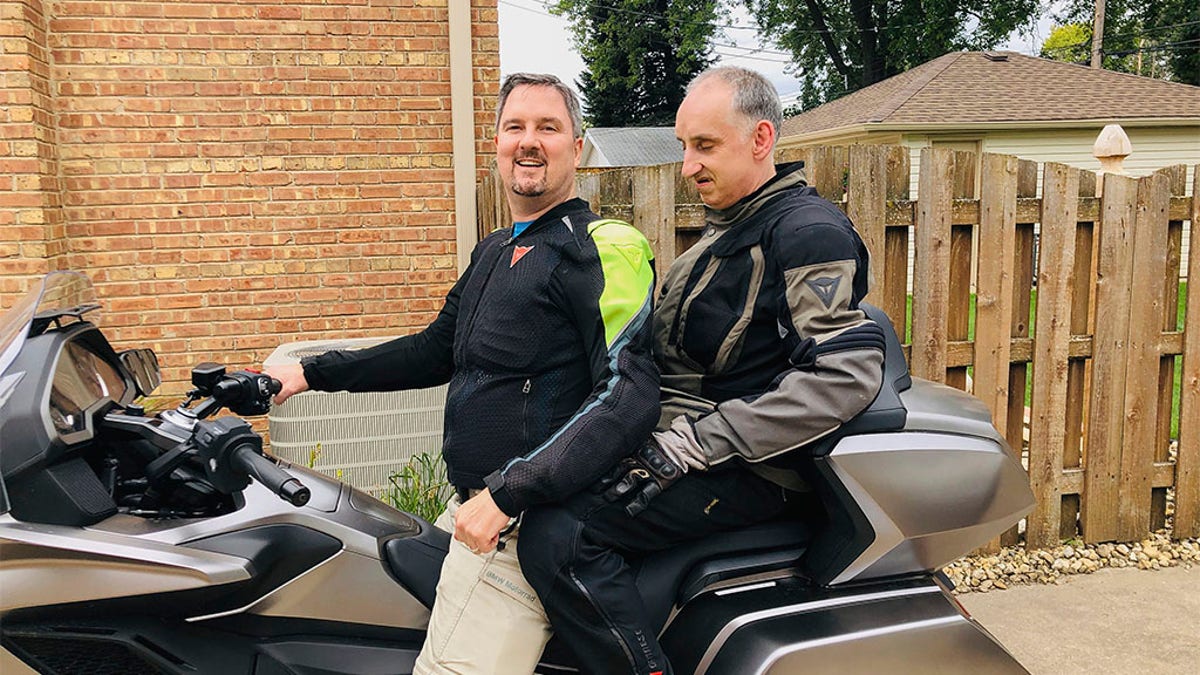 This 2019 photo provided by the family shows Joe Sullivan, right, of the Chicago-area, with his brother, Neil. When COVID-19 began spreading across the country, Neil prayed it wouldn’t hit Elisabeth Ludeman Developmental Center _ where 346 people live in 40 ranch-style homes spread across a campus that resembles an apartment complex. If it did, he knew his brother and others there would be in danger. (Family photo via AP)