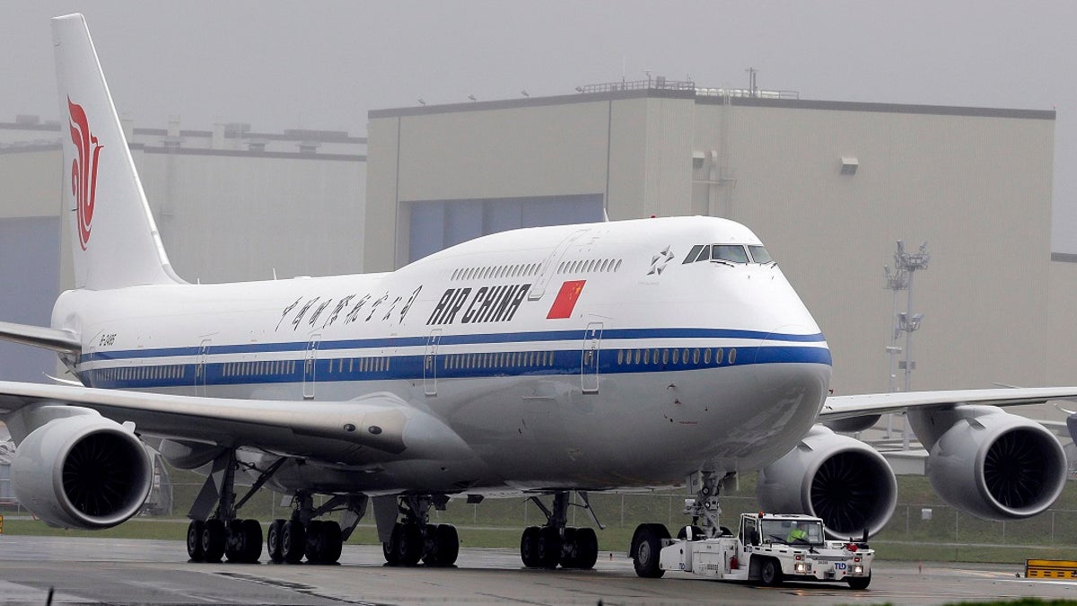Many airlines are suspending flights in and out of Beijing over a possible second wave of COVID-19 cases.  (AP Photo/Ted S. Warren, File)
