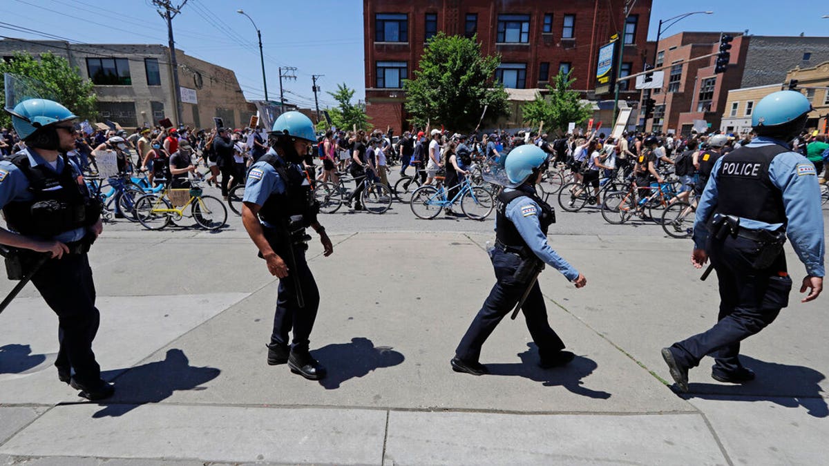 Demonstrators march during the Chicago March for Justice in honor of George Floyd in Chicago, June 6, 2020. (AP Photo/Nam Y. Huh)
