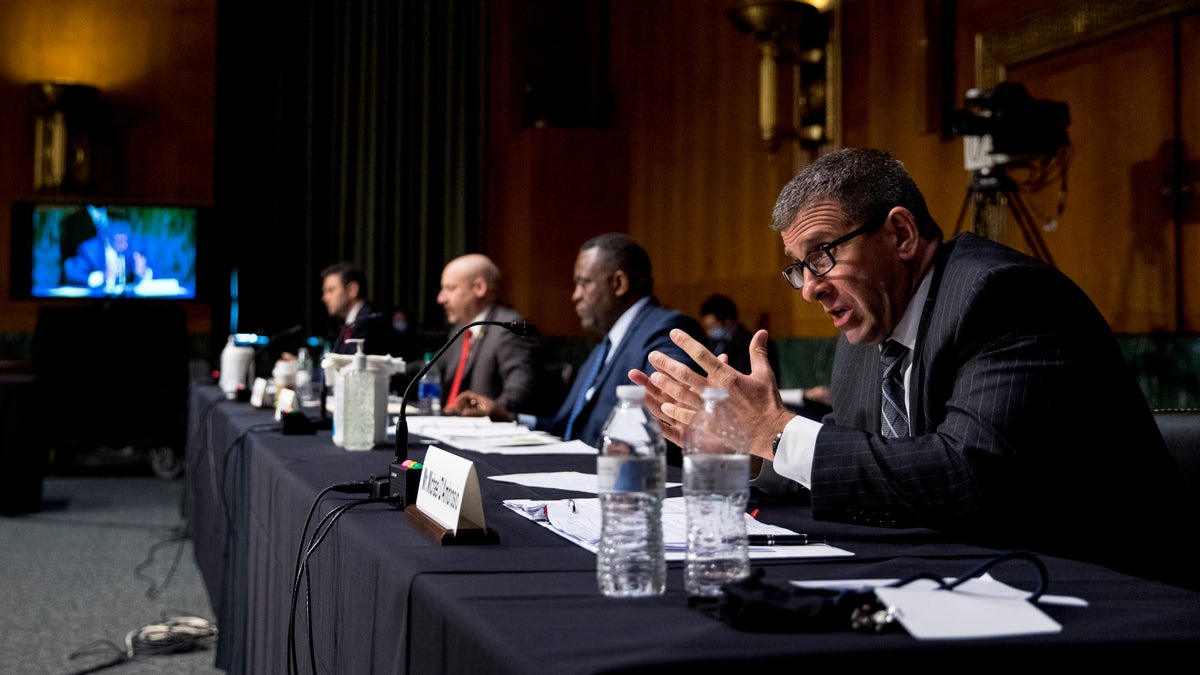 Secret Service Assistant Director Michael D'Ambrosio, right, accompanied by from left, Justice Department Associate Deputy Attorney General William Hughes, Justice Department U.S. Attorney Craig Carpenito, and FBI Criminal Investigative Division Assistant Director Calvin A. Shivers, speaks at a Senate Judiciary Committee hearing on Capitol Hill in Washington, Tuesday, June 9, 2020. (Associated Press)