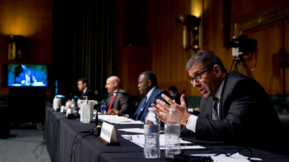 Secret Service Assistant Director Michael D'Ambrosio, right, accompanied by from left, Justice Department Associate Deputy Attorney General William Hughes, Justice Department U.S. Attorney Craig Carpenito, and FBI Criminal Investigative Division Assistant Director Calvin A. Shivers, speaks at a Senate Judiciary Committee hearing on Capitol Hill in Washington, Tuesday, June 9, 2020. (Associated Press)