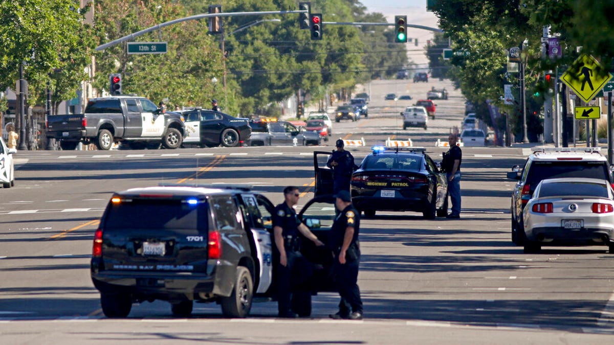 Law enforcement personnel from several jurisdictions patrolling downtown Paso Robles, Calif., on Wednesday.