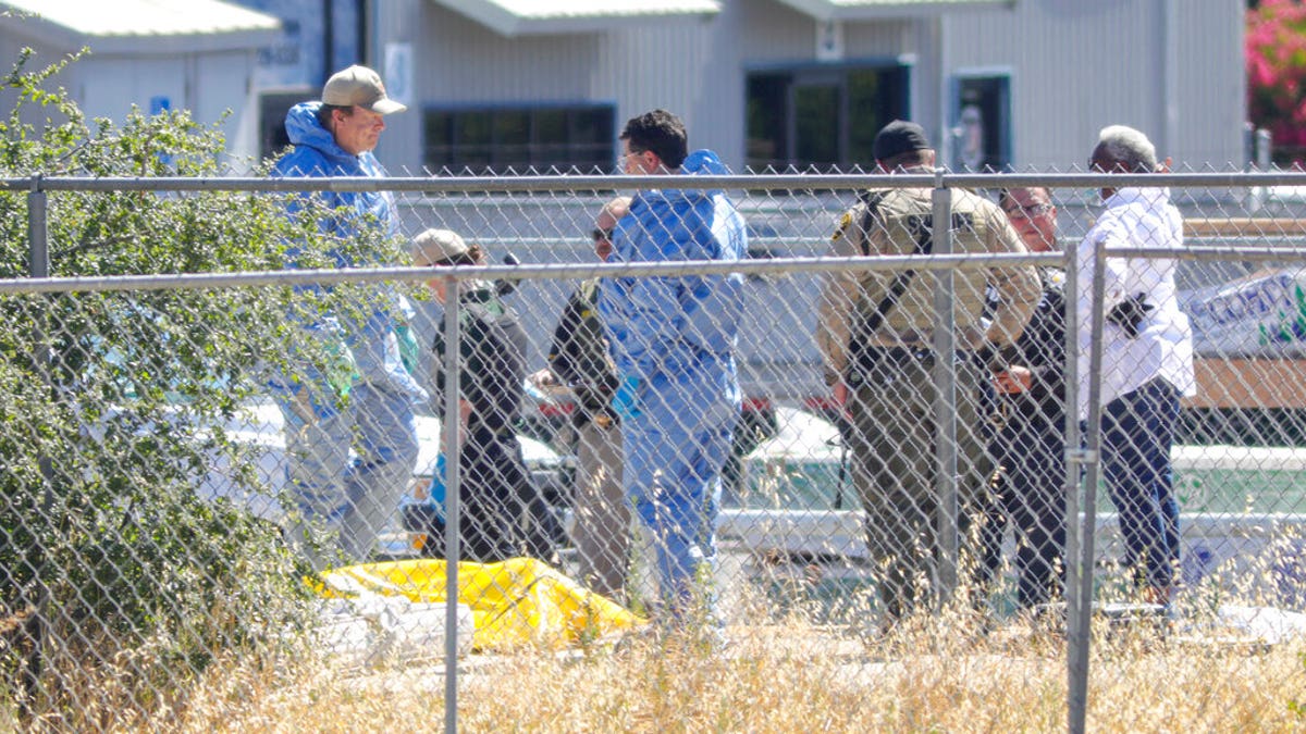 Members of San Luis Obispo County Sheriff-Coronor's office and Paso Robles Police department investigate the scene of a shooting, Wednesday June 10, 2020 in Paso Robles, Calif. 