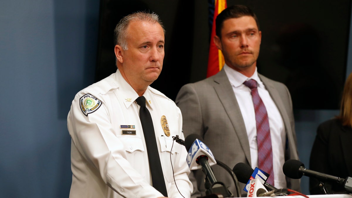 Florissant Police Chief Timothy Fagan, left, speaking alongside St. Charles County Prosecuting Attorney Tim Lohmar, right, during a news conference Wednesday.