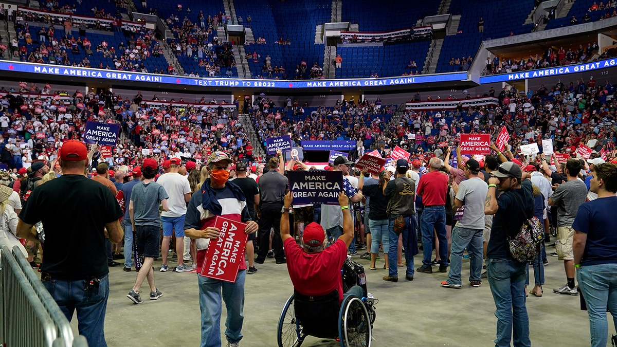 President Trump supporters listen to Trump speak during a campaign rally at the BOK Center, Saturday, June 20, 2020, in Tulsa, Okla. (AP Photo/Evan Vucci)