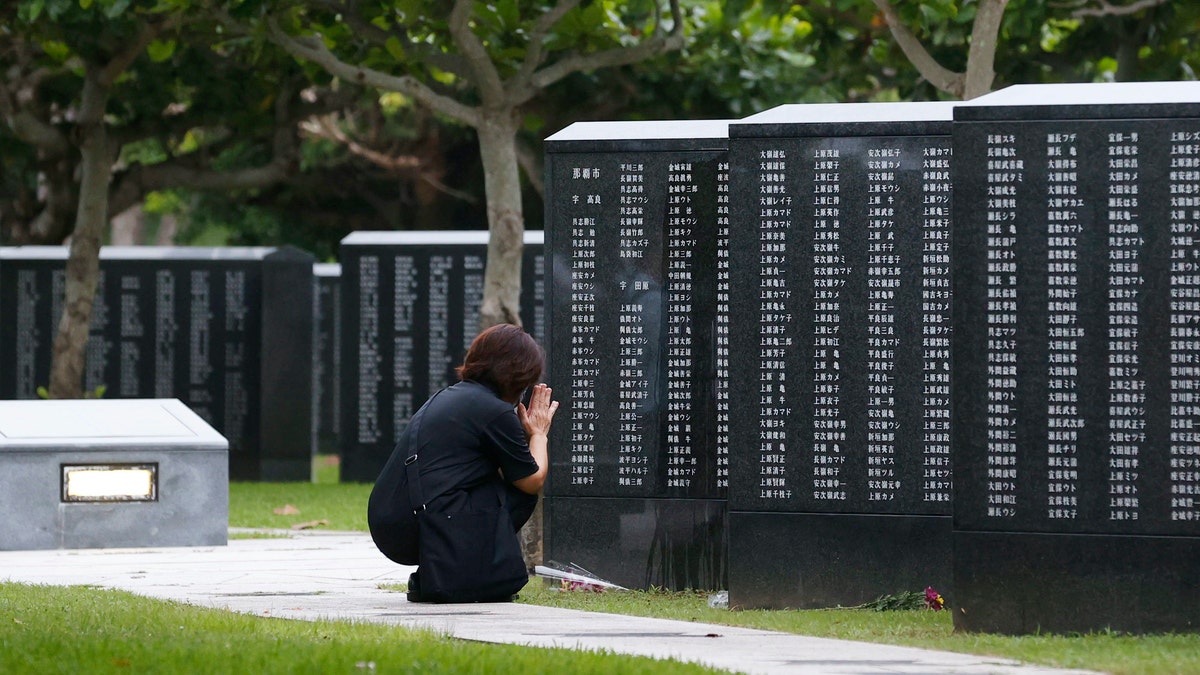 Okinawan people find it unacceptable that their land is still occupied by a heavy U.S. military presence even 75 years after World War II. They have asked the central government to do more to reduce their burden, and Prime Minister Shinzo Abe's government repeatedly say it is mindful of their feelings, but the changes are slow to come. (Kyodo News via AP)