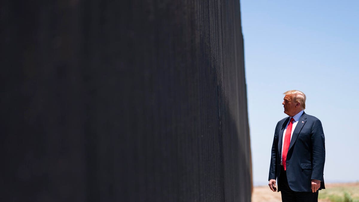President Donald Trump tours a section of the border wall, Tuesday, June 23, 2020, in San Luis, Ariz. (AP Photo/Evan Vucci)